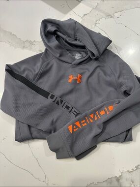 Under Armour Gray Hoodie with Orange Logo and Sleeve Accents in dryfit material